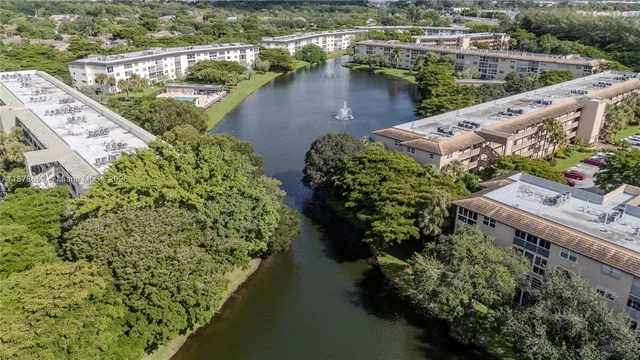 an aerial view of a house with a lake view