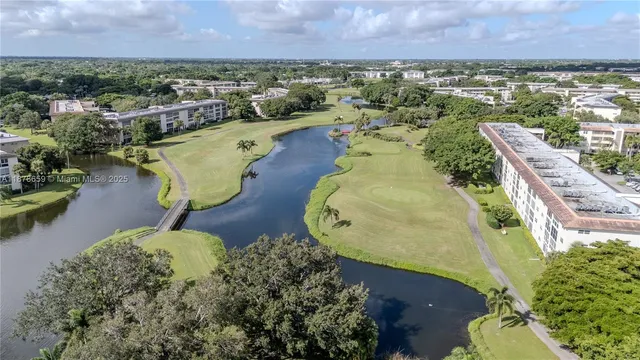 an aerial view of a house with a lake view