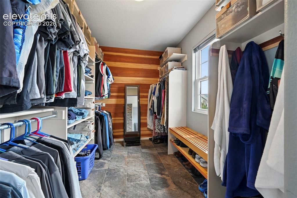 12571 Scamper Road Peyton, CO 80831 - Photo 21 of 49 Stunning walk in closet primary bedroom,