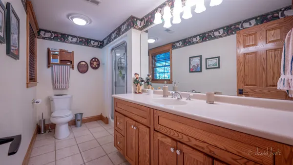 a bedroom with a bed a couch and a couch