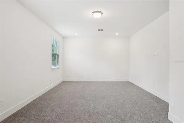 an empty room with a empty space and window