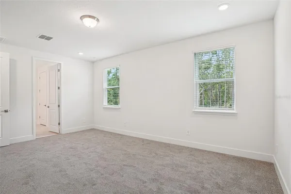 an empty room with windows