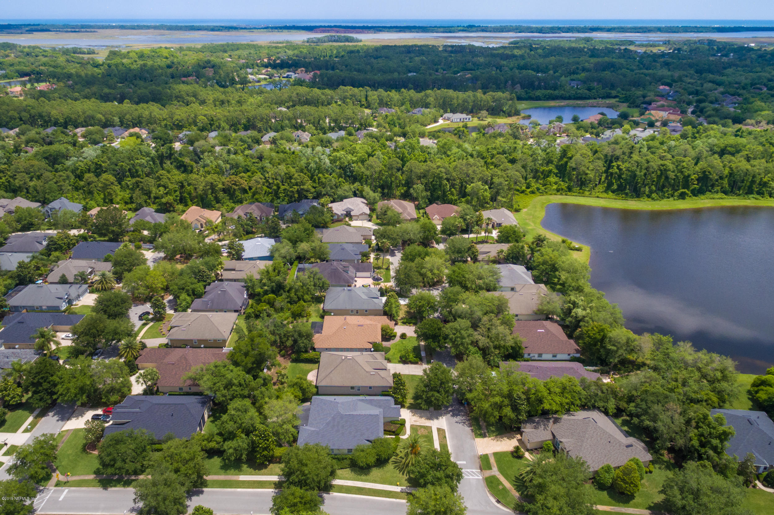 800 Riley Lane St. Augustine, FL 32095 - Photo 2 of 88 an aerial view of a house with a yard and lake view