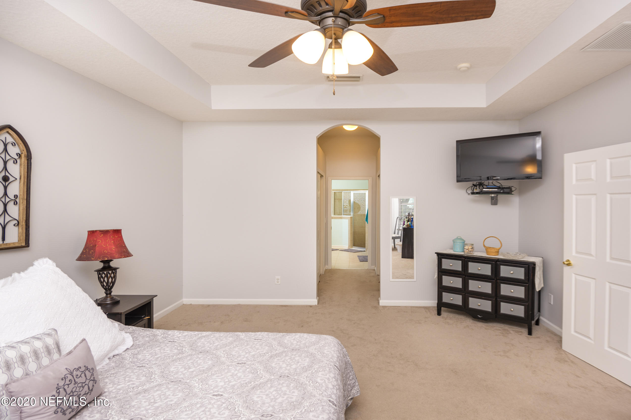 800 Riley Lane St. Augustine, FL 32095 - Photo 29 of 88 a bedroom with furniture and a flat screen tv