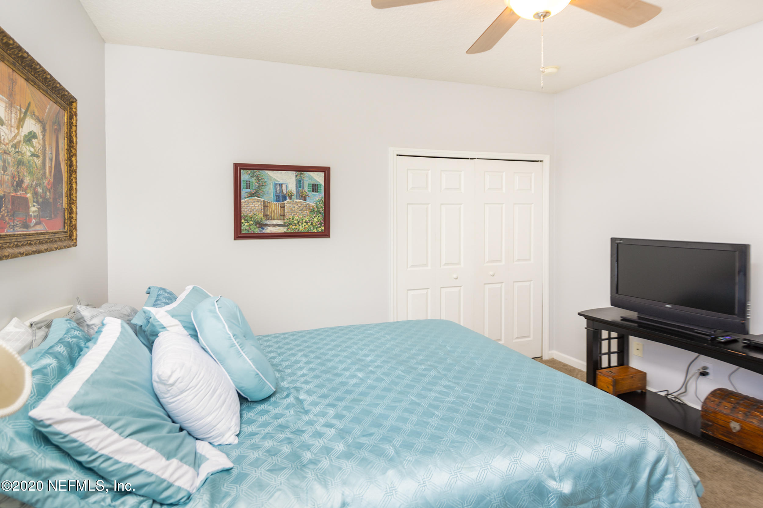 800 Riley Lane St. Augustine, FL 32095 - Photo 37 of 88 a bedroom with a bed and a flat screen tv