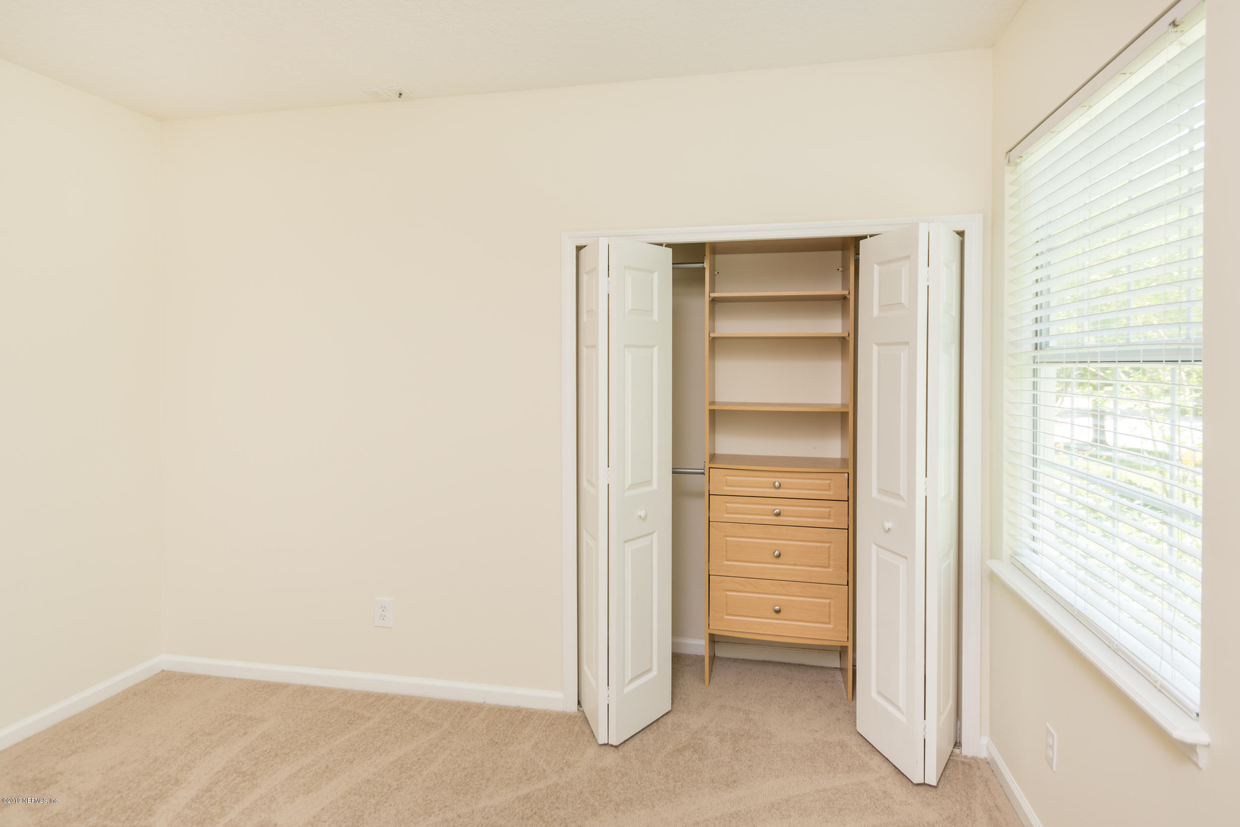 800 Riley Lane St. Augustine, FL 32095 - Photo 40 of 88 a view of walk in closet with empty racks