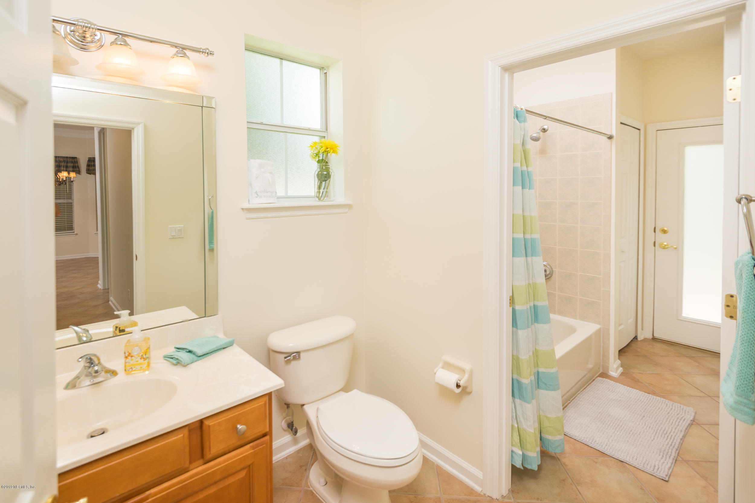 800 Riley Lane St. Augustine, FL 32095 - Photo 41 of 88 a bathroom with a sink a toilet and shower