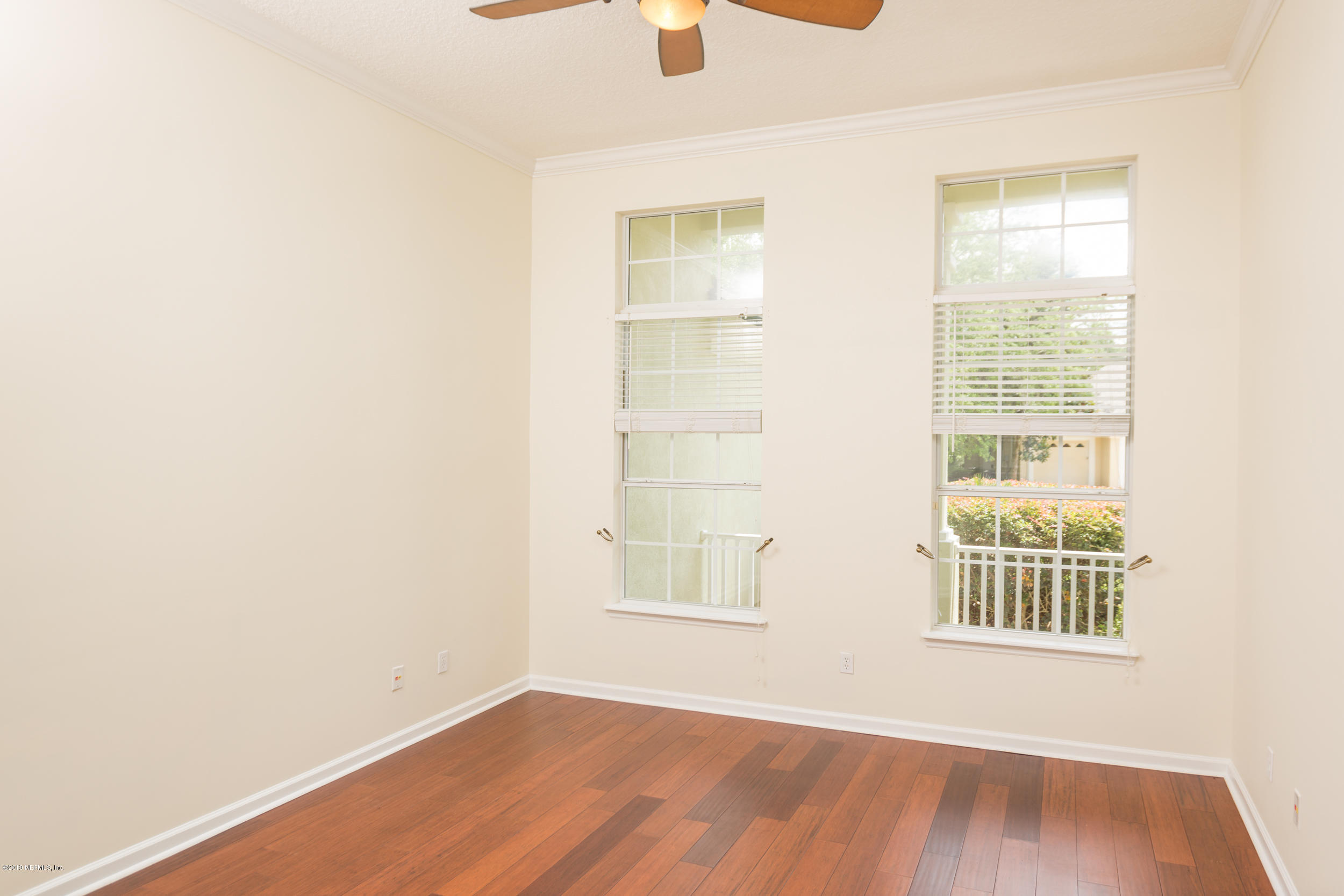 800 Riley Lane St. Augustine, FL 32095 - Photo 48 of 88 a view of an empty room with wooden floor and a window