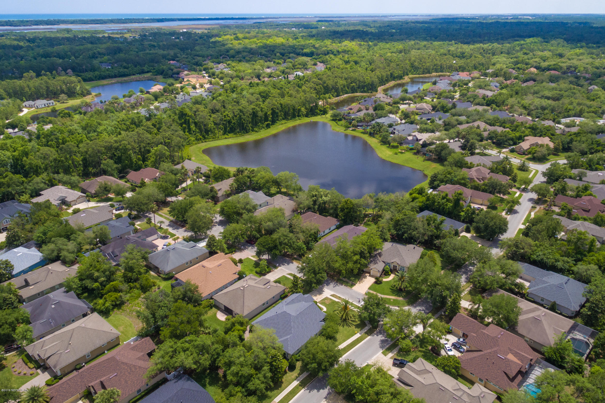 800 Riley Lane St. Augustine, FL 32095 - Photo 61 of 88 an aerial view of residential houses with outdoor space and trees