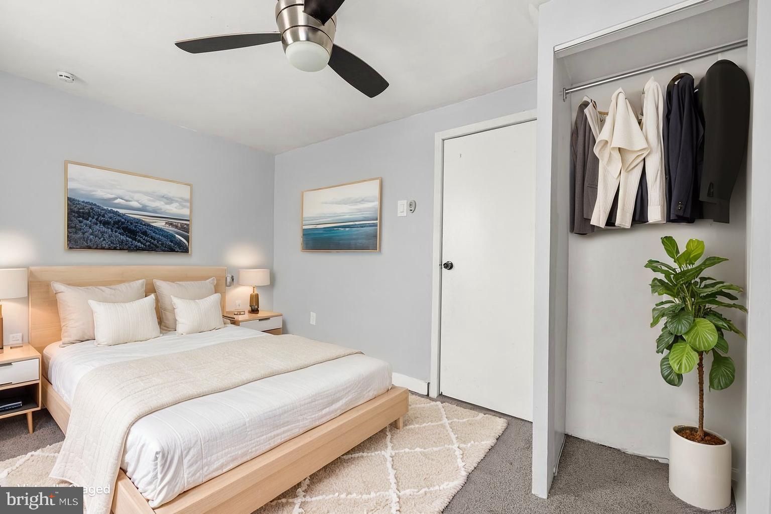 578 Swain Street Bristol, PA 19007 - Photo 13 of 17 a bedroom with a bed and a potted plant