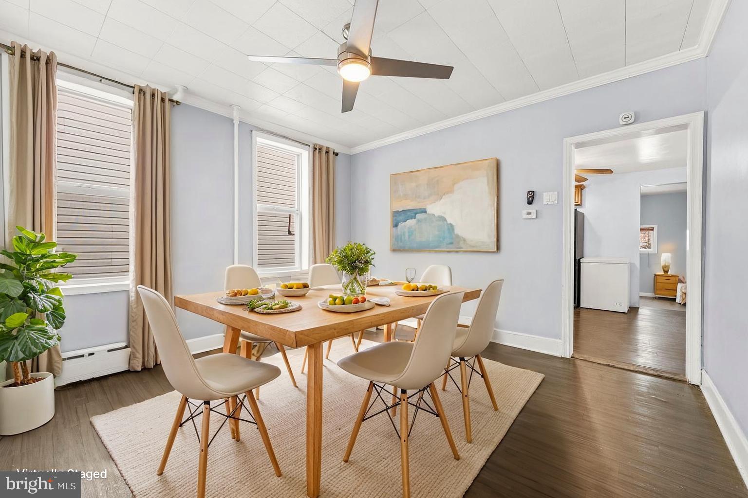 578 Swain Street Bristol, PA 19007 - Photo 3 of 17 a view of a dining room with furniture and wooden floor