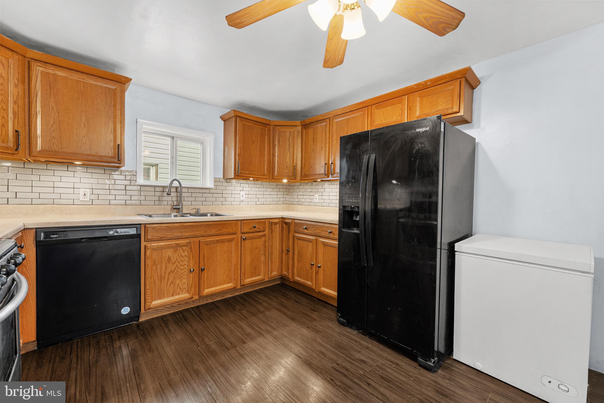 578 Swain Street Bristol, PA 19007 - Photo 7 of 17 a kitchen with a refrigerator and a sink