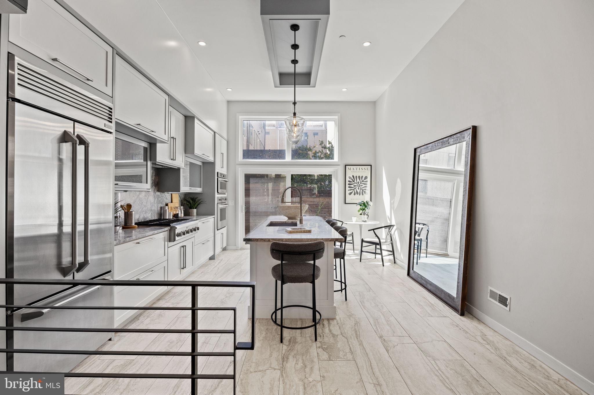 2106 Spring Street Philadelphia, PA 19103 - Photo 16 of 68 a view of a dining room with furniture window and wooden floor