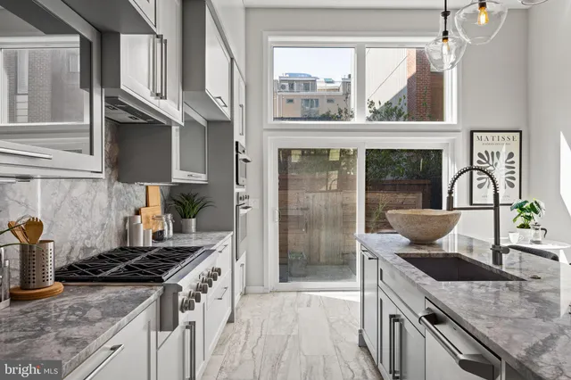 a view of entryway livingroom and hall with wooden floor