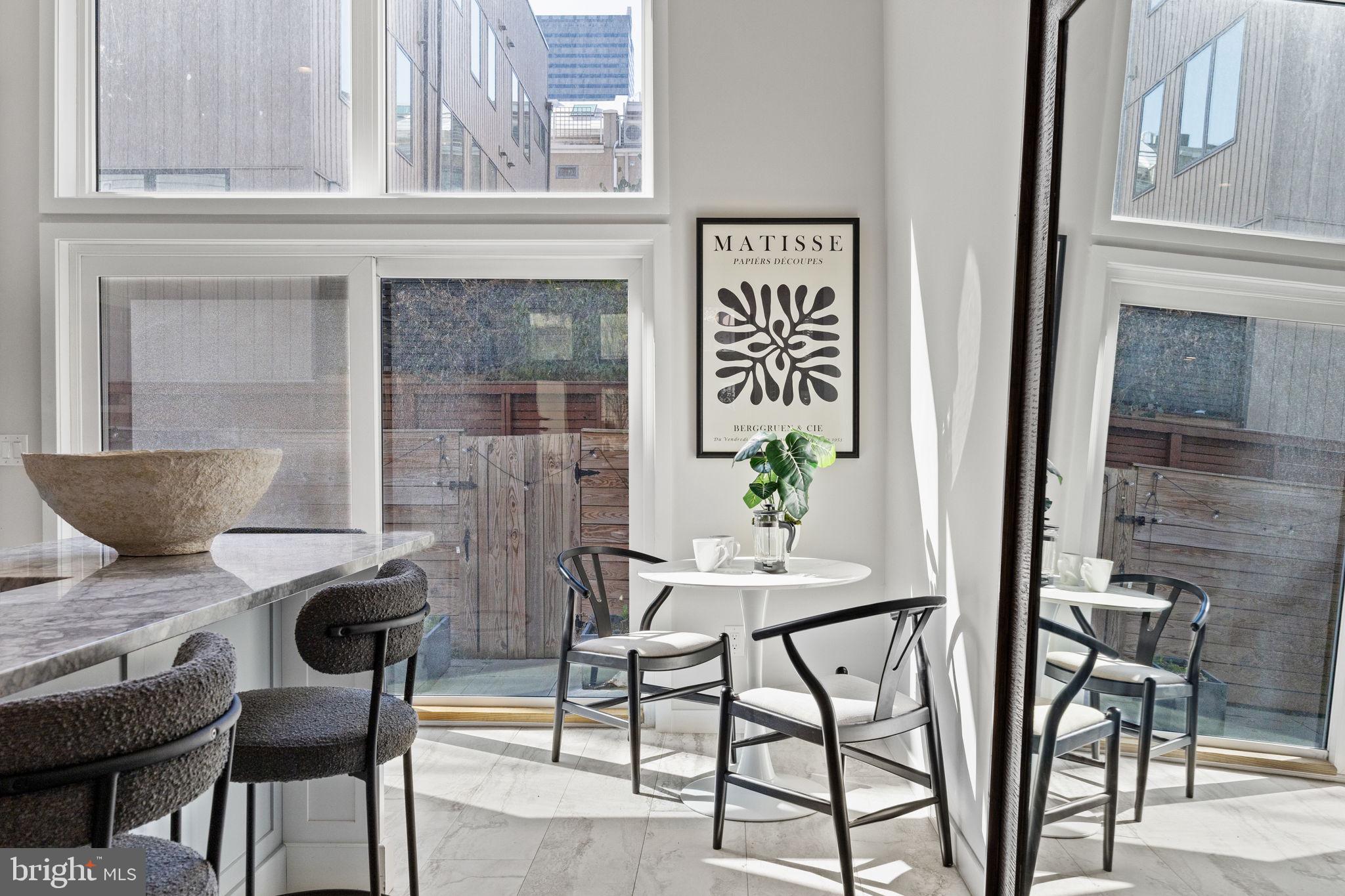 2106 Spring Street Philadelphia, PA 19103 - Photo 20 of 68 a view of a dining room with furniture and a potted plant