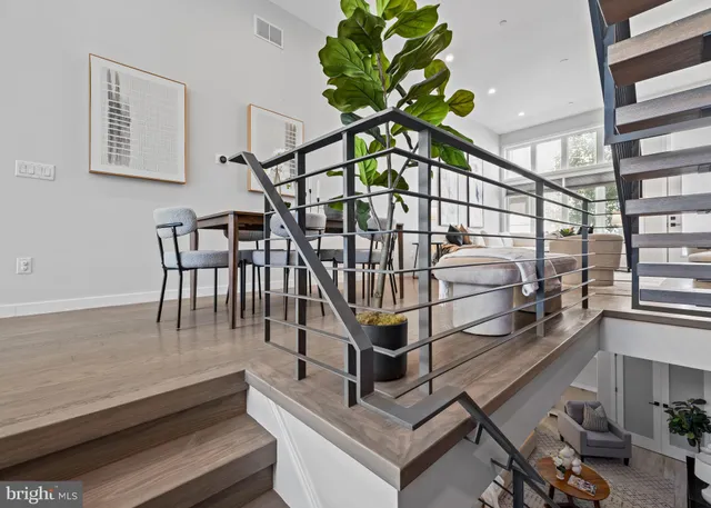 a spacious bedroom with a bed and a couch