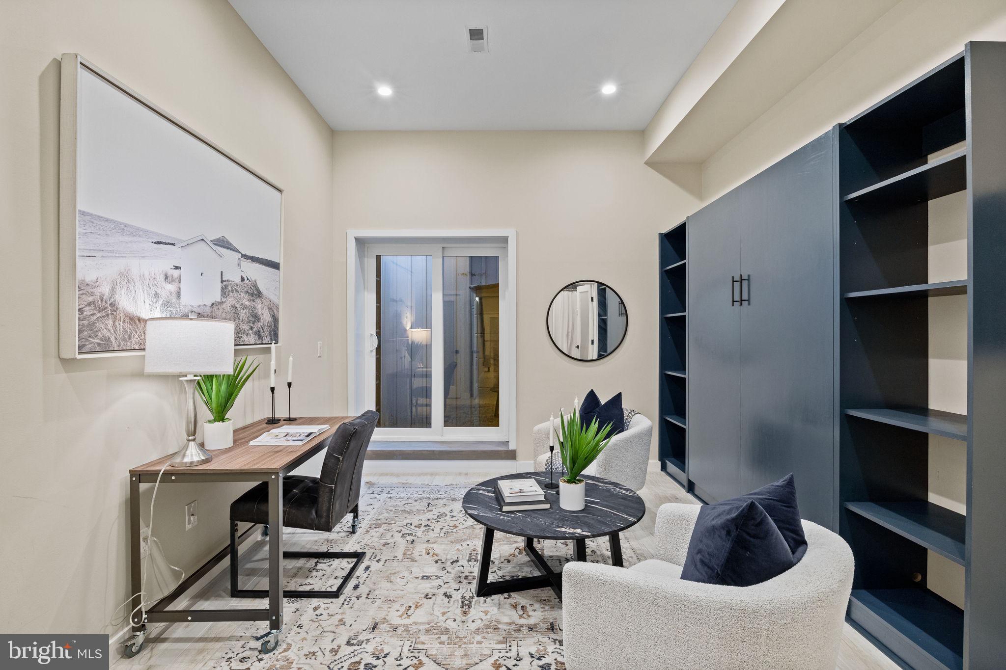 2106 Spring Street Philadelphia, PA 19103 - Photo 28 of 68 a living room with furniture potted plant and a mirror