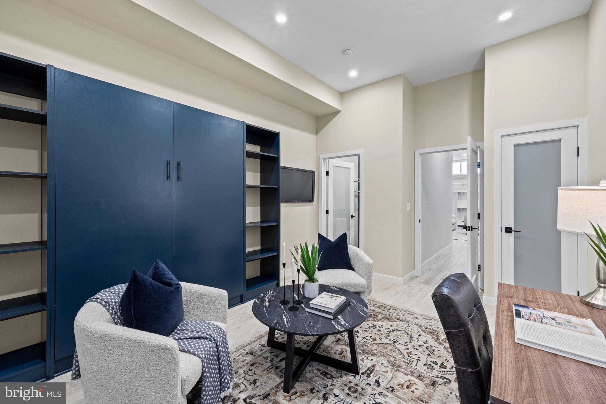 2106 Spring Street Philadelphia, PA 19103 - Photo 29 of 68 a living room with furniture and a rug