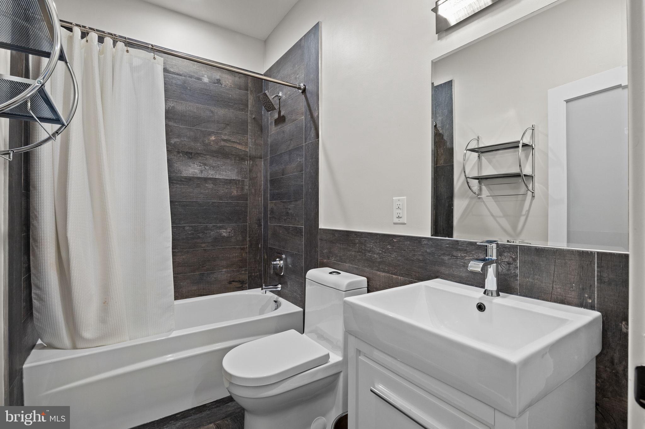2106 Spring Street Philadelphia, PA 19103 - Photo 31 of 68 a bathroom with a sink toilet and shower