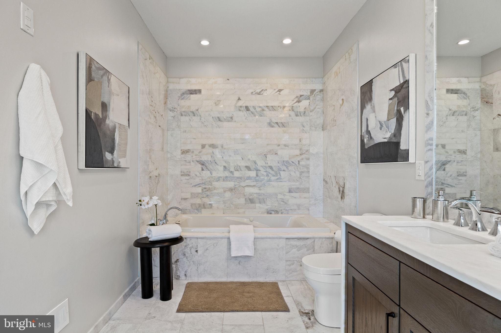 2106 Spring Street Philadelphia, PA 19103 - Photo 51 of 68 a bathroom with a sink a mirror and a shower