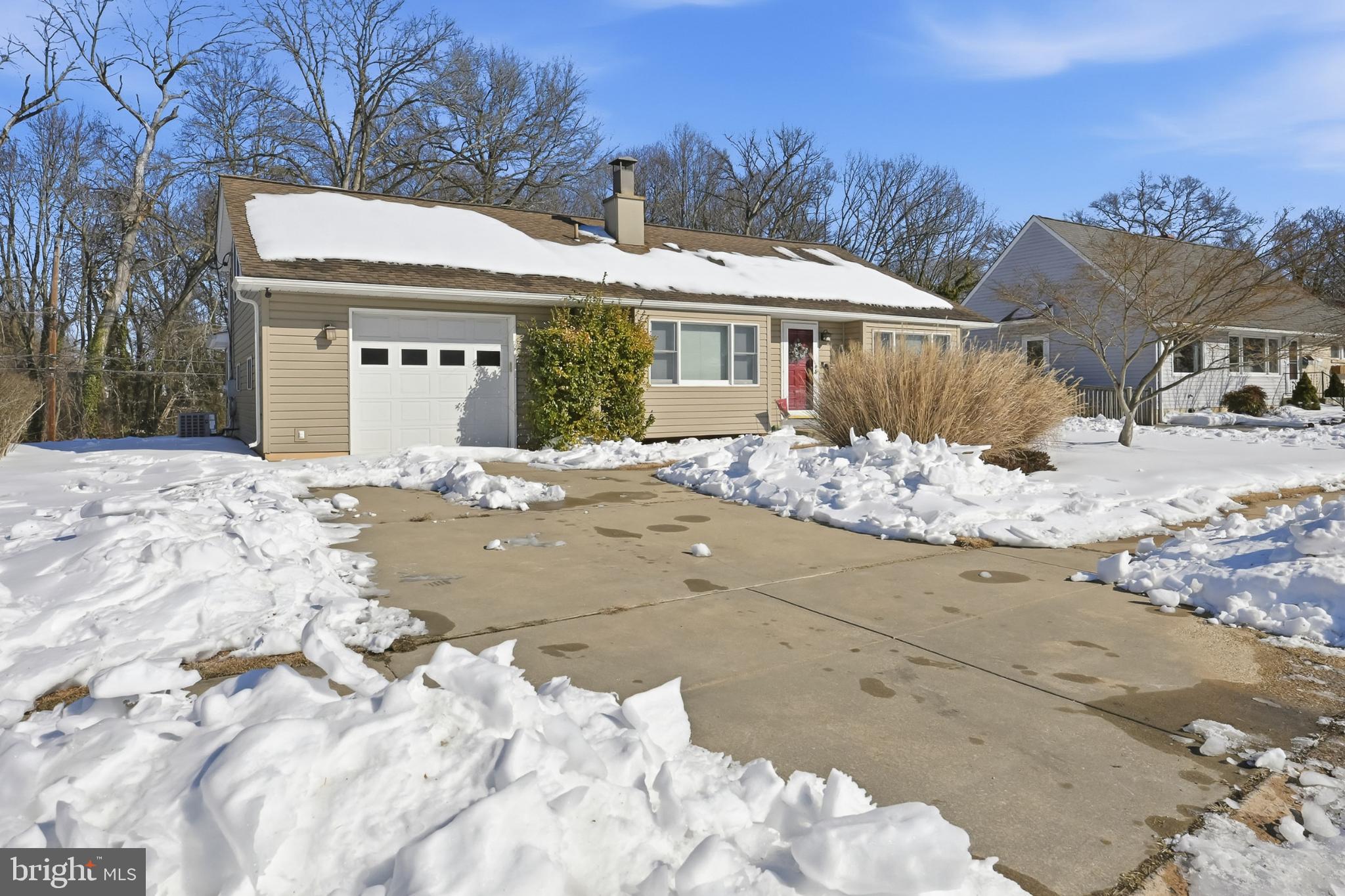 619 Shue Drive Newark, DE 19713 - Photo 1 of 30 a view of a house with a yard covered in snow