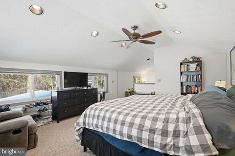 a bedroom with a bed and furniture