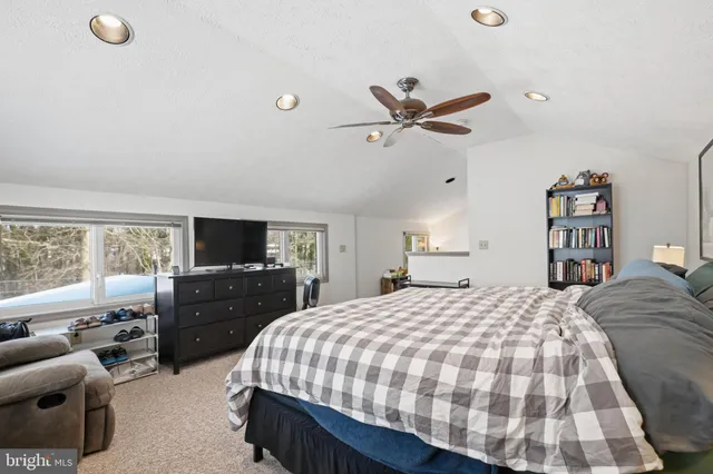 a bedroom with a bed and furniture