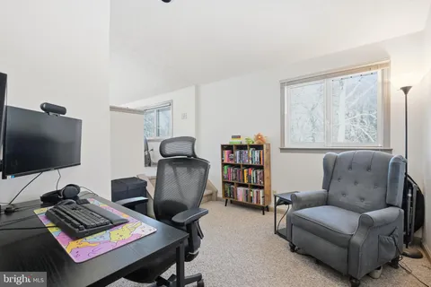 a workspace with furniture and a window