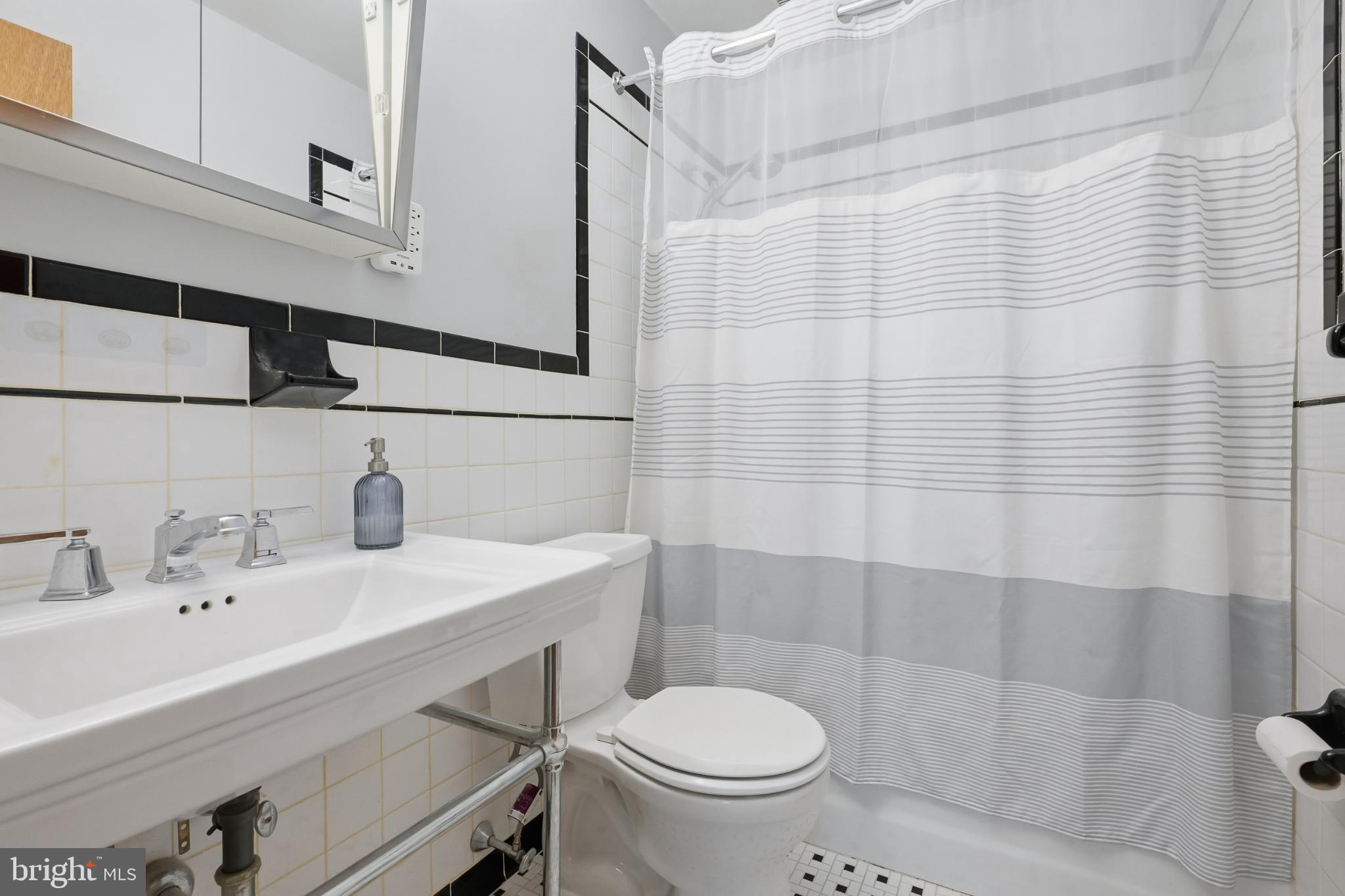 619 Shue Drive Newark, DE 19713 - Photo 17 of 30 a bathroom with a sink a toilet and shower