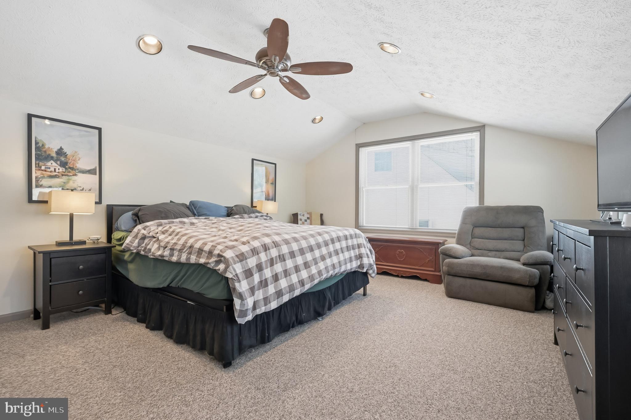 619 Shue Drive Newark, DE 19713 - Photo 10 of 30 a bedroom with a bed a couch and a window