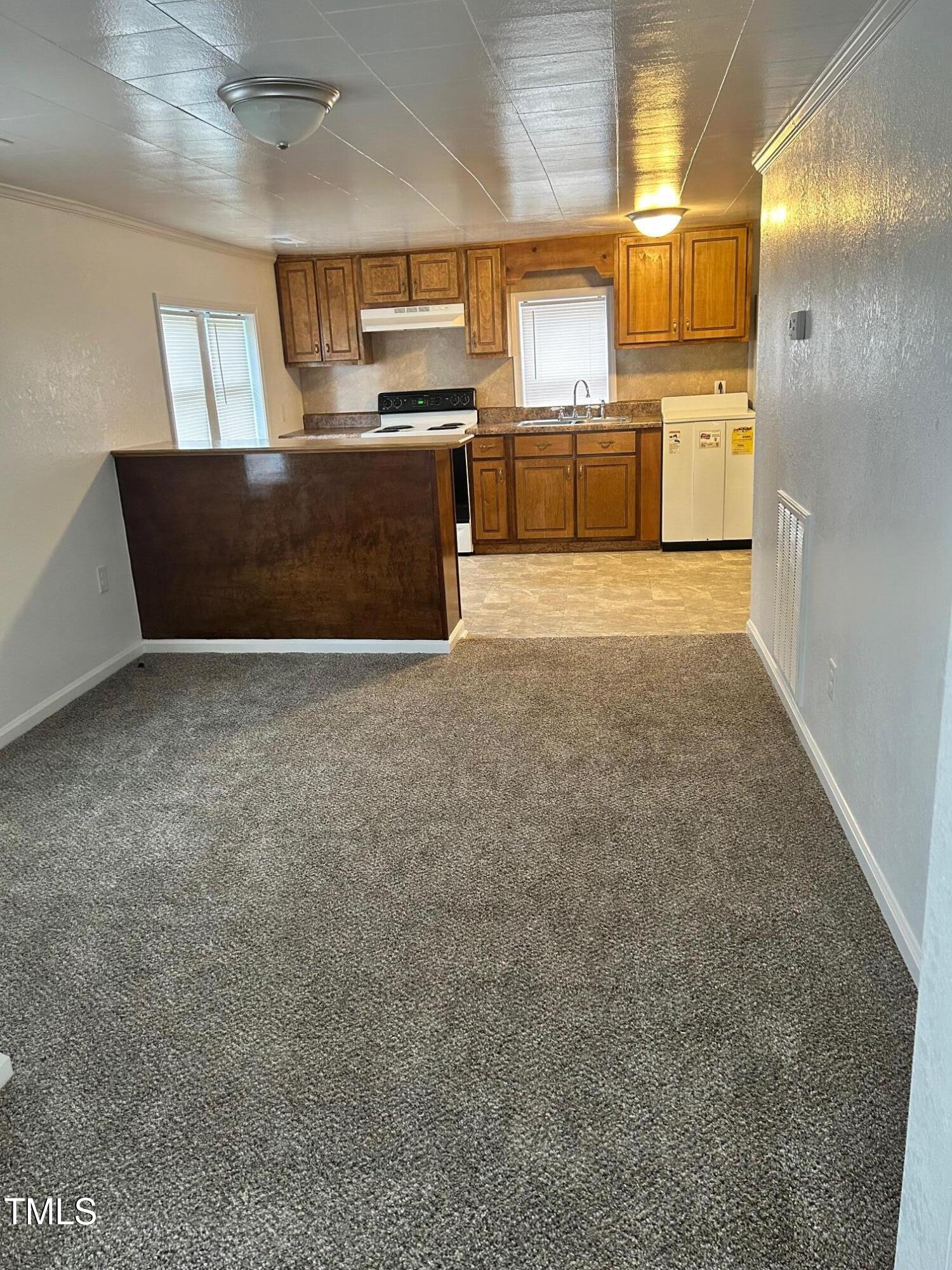 10841 Highway 32 Roper, NC 27970 - Photo 23 of 29 a view of a kitchen with a sink and dishwasher a oven with wooden floor
