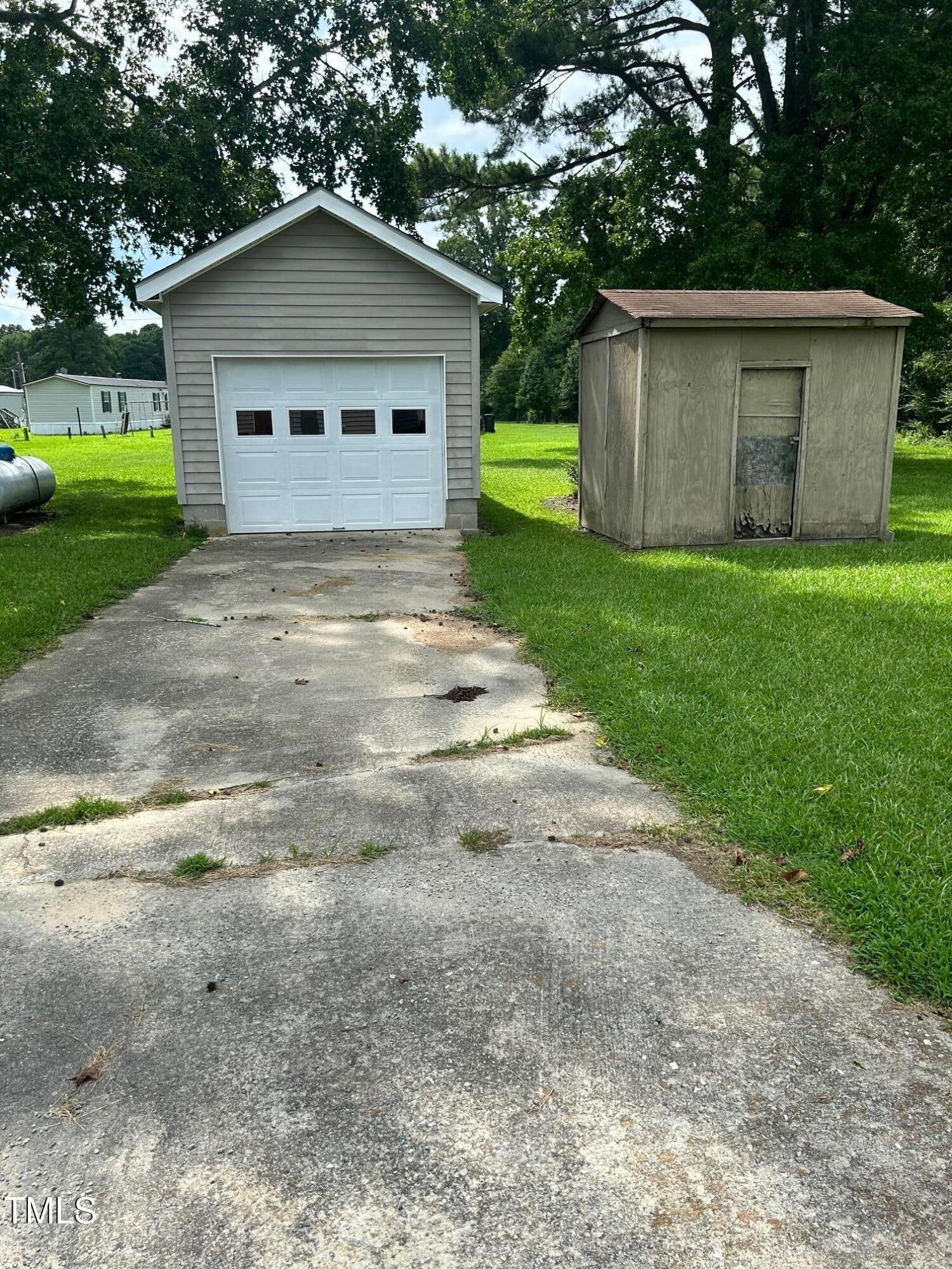 10841 Highway 32 Roper, NC 27970 - Photo 25 of 29 a front view of a house with a yard and garage