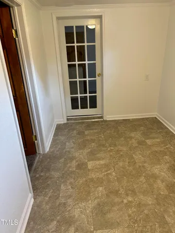 a view of empty room with windows