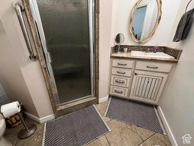 2855 South 1000 West Perry, UT 84302 - Photo 88 of 142 ADU - Bathroom with a shower stall, vanity, and light tile flooring