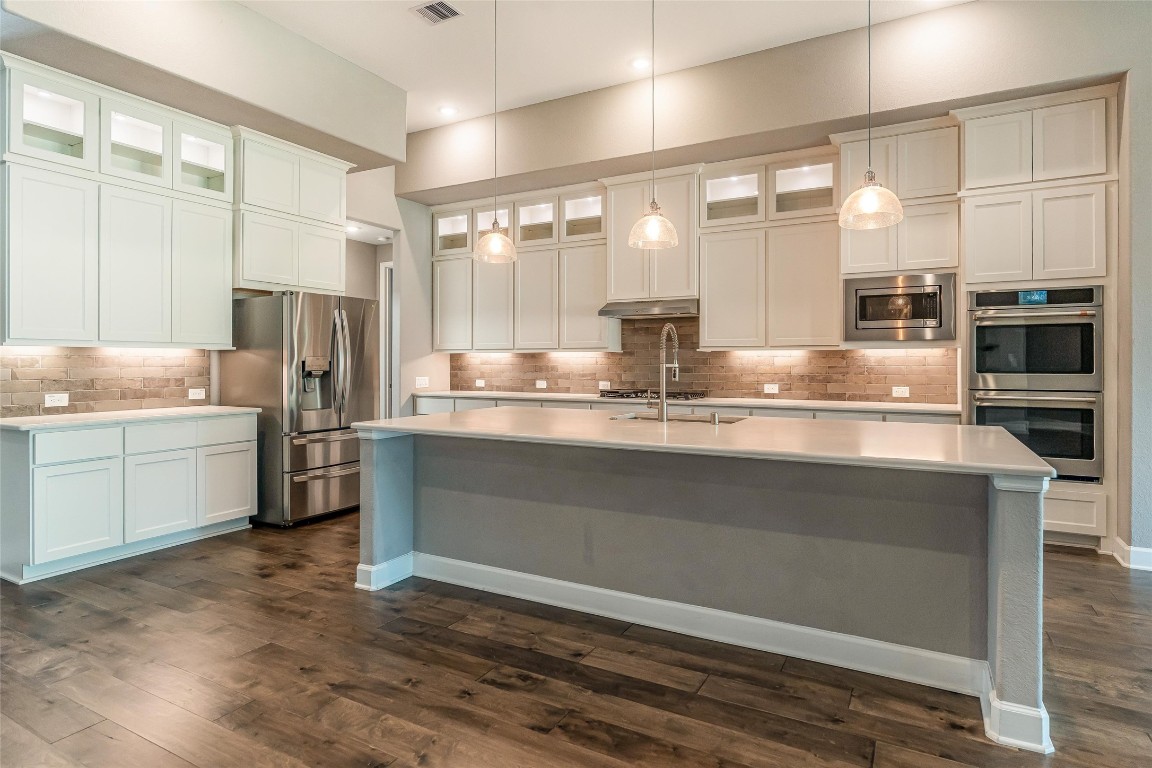 1050 Groveton Ridge Lane Pinehurst, TX 77362 - Photo 18 of 50 Check out this huge Granite island with area for four barstools.