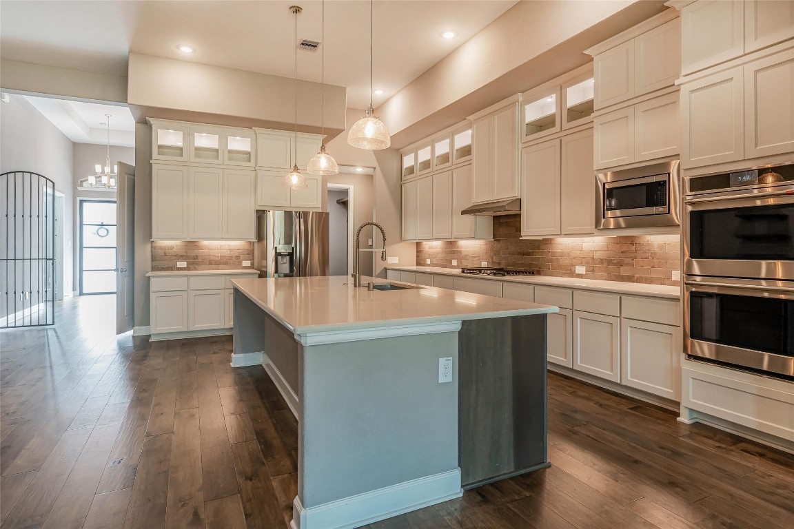 1050 Groveton Ridge Lane Pinehurst, TX 77362 - Photo 19 of 50 Under counter lighting, stainless appliance including the 4-drawer stainless refrigerator