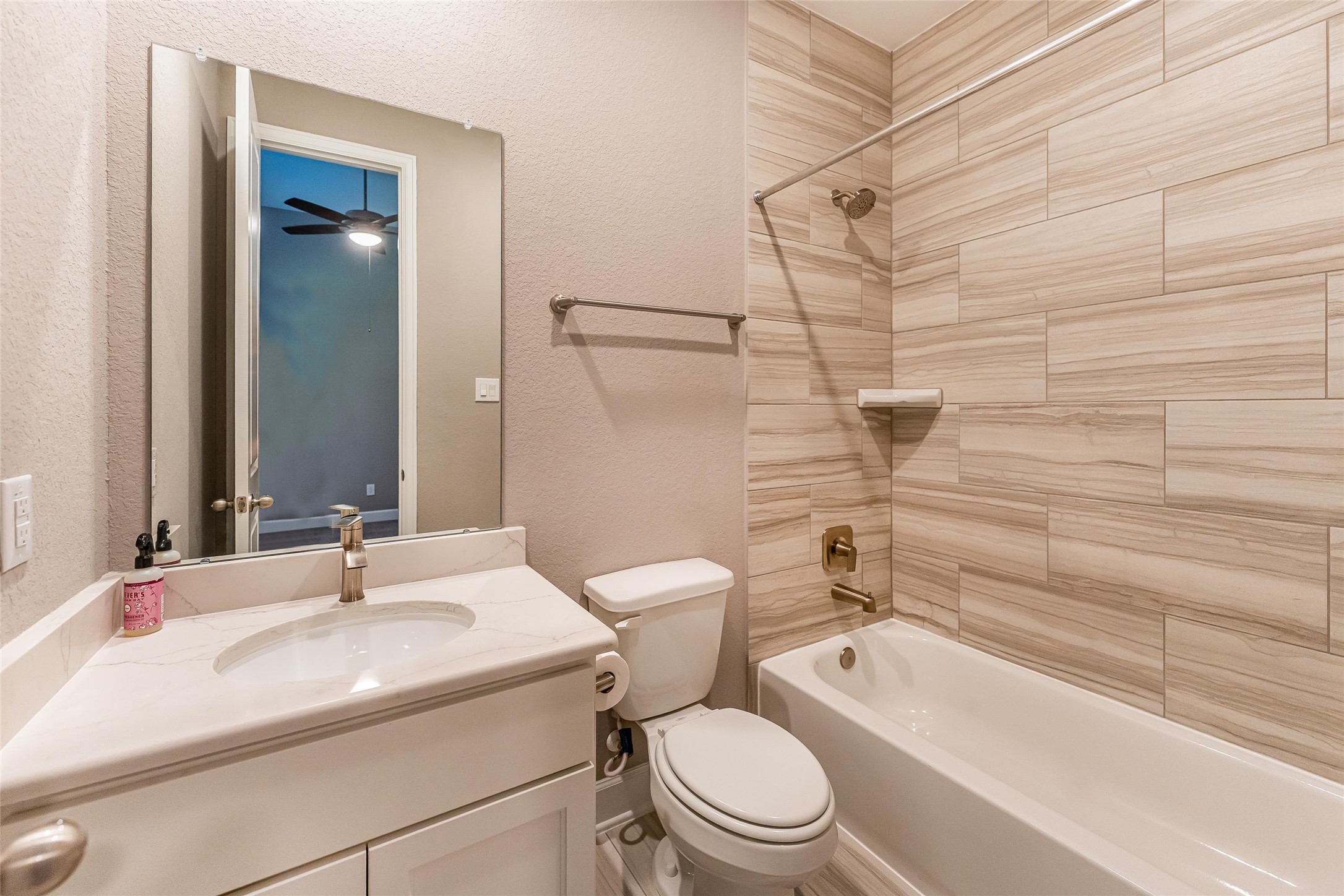 1050 Groveton Ridge Lane Pinehurst, TX 77362 - Photo 36 of 50 a bathroom with a sink a toilet and shower