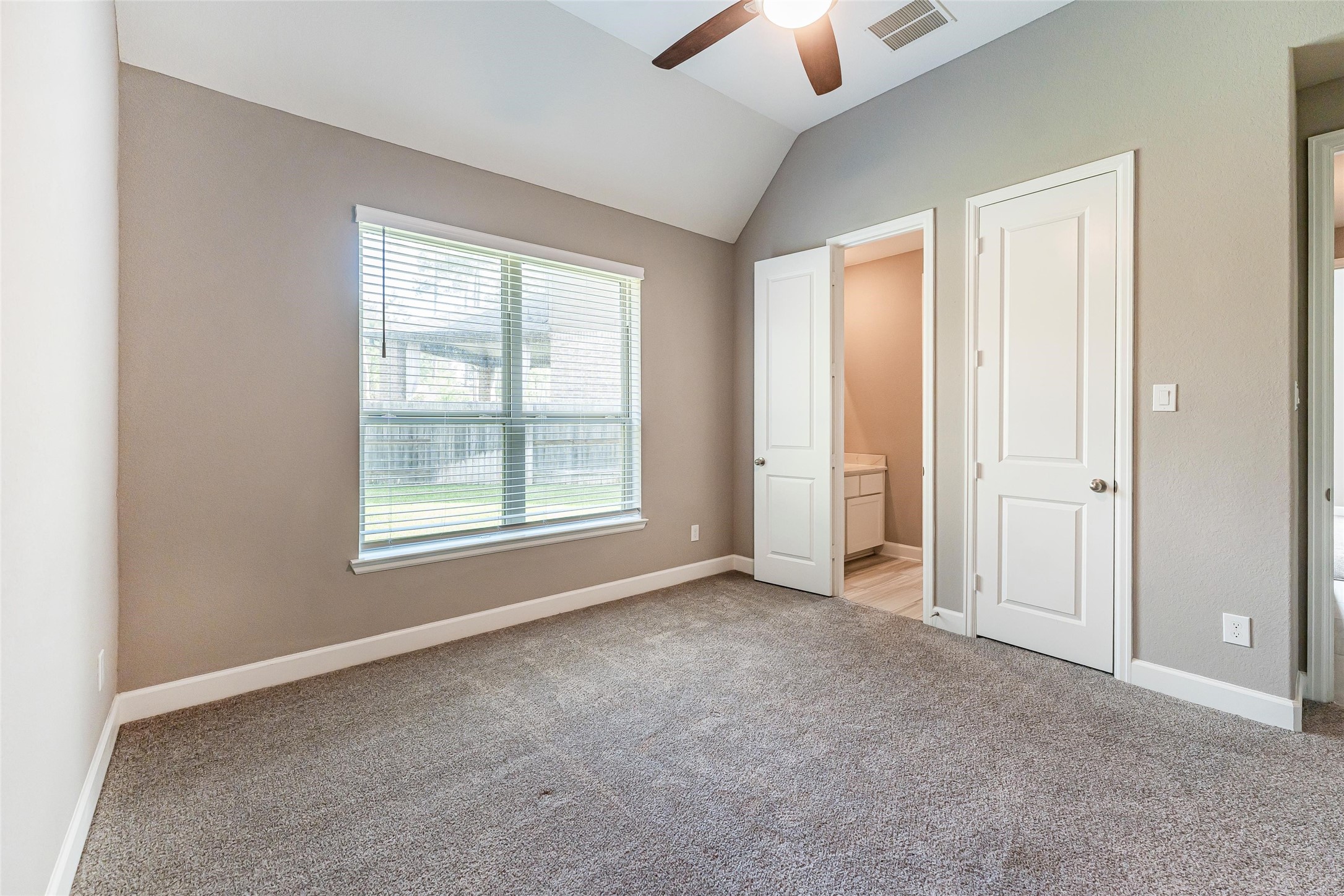 1050 Groveton Ridge Lane Pinehurst, TX 77362 - Photo 40 of 50 an empty room with windows