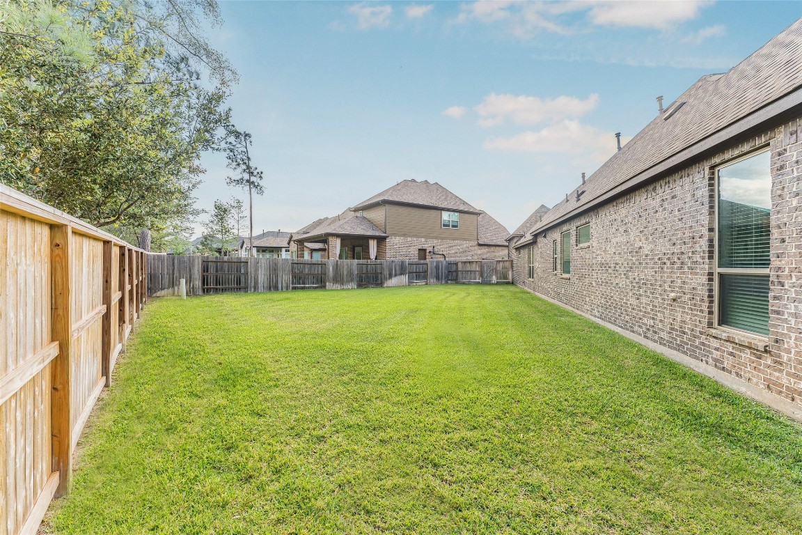 1050 Groveton Ridge Lane Pinehurst, TX 77362 - Photo 44 of 50 This is the other private side yard