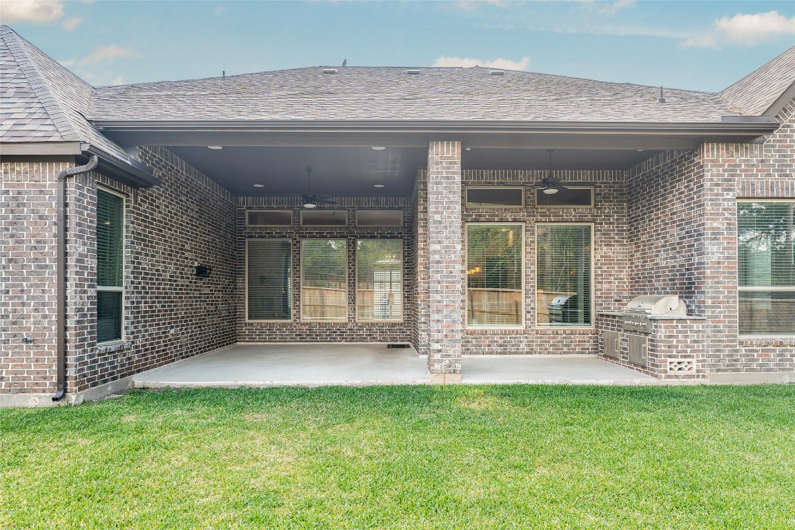1050 Groveton Ridge Lane Pinehurst, TX 77362 - Photo 45 of 50 View of the extra large covered patio with outdoor kitchen