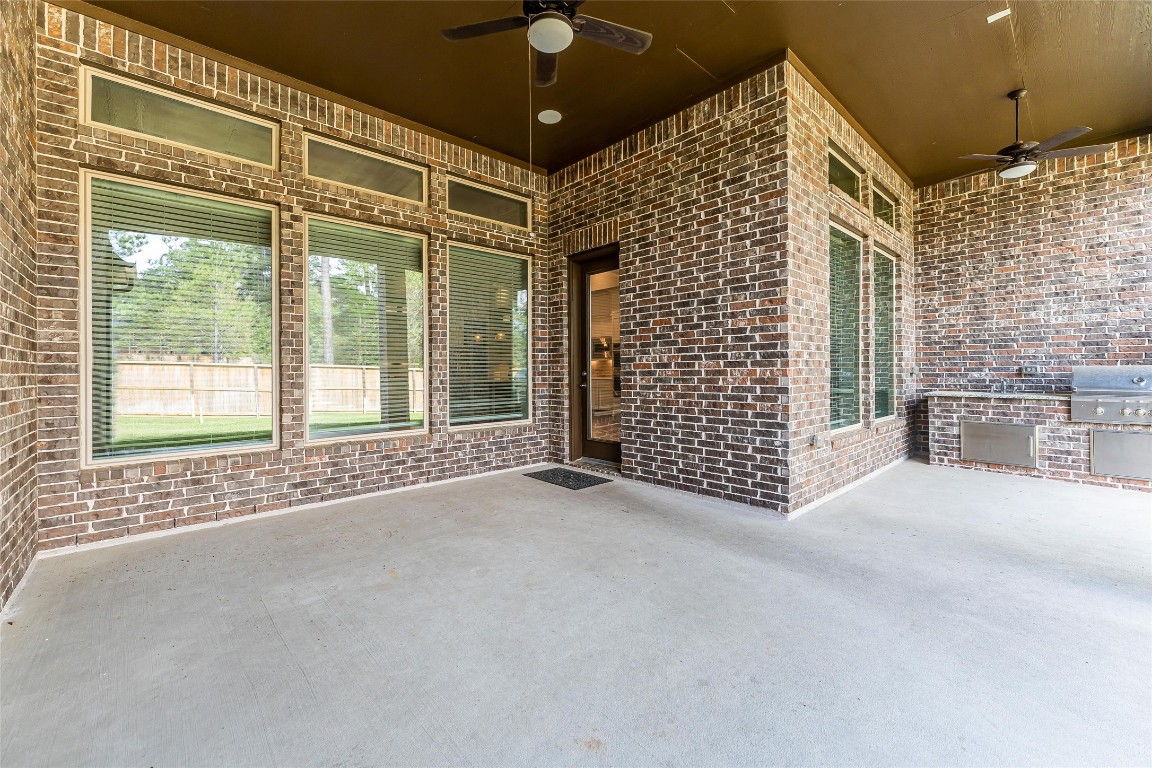 1050 Groveton Ridge Lane Pinehurst, TX 77362 - Photo 46 of 50 Large covered patio out back