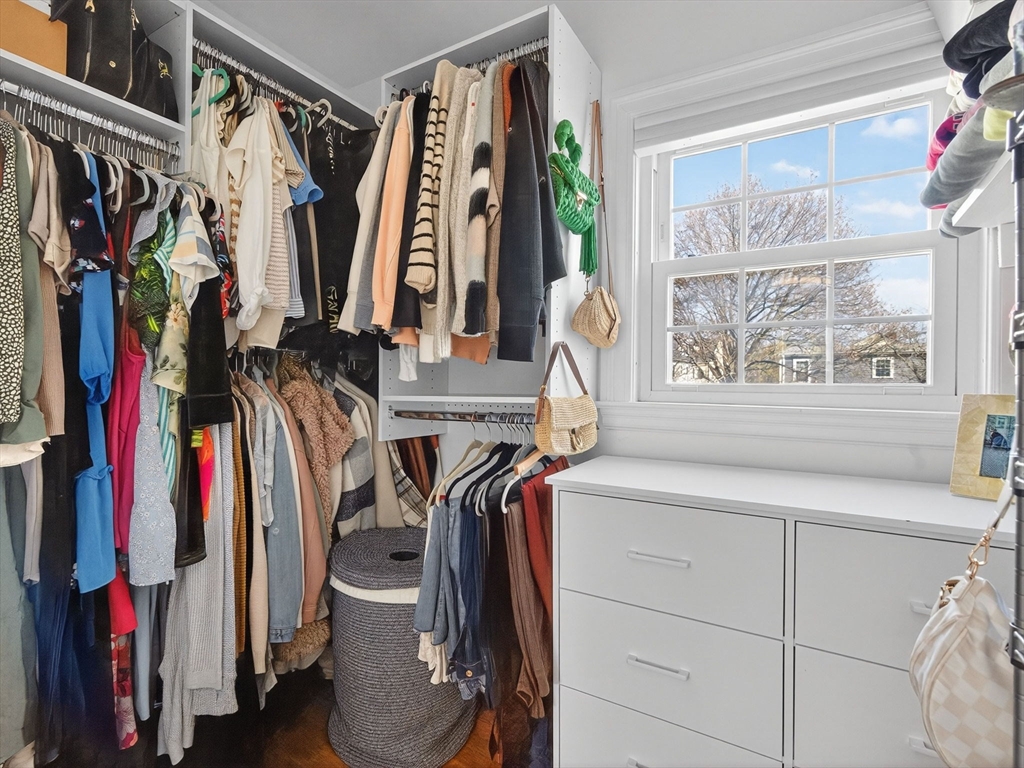37 Rangeley Street Boston, MA 02124 - Photo 19 of 26 a view of walk in closet with clothes and shoes