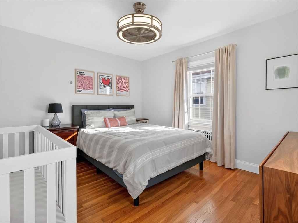 37 Rangeley Street Boston, MA 02124 - Photo 22 of 26 a bedroom with a bed and a large window