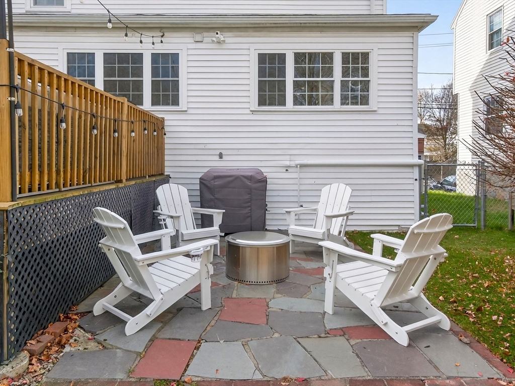 37 Rangeley Street Boston, MA 02124 - Photo 25 of 26 a view of a chairs and table in the back yard of the house