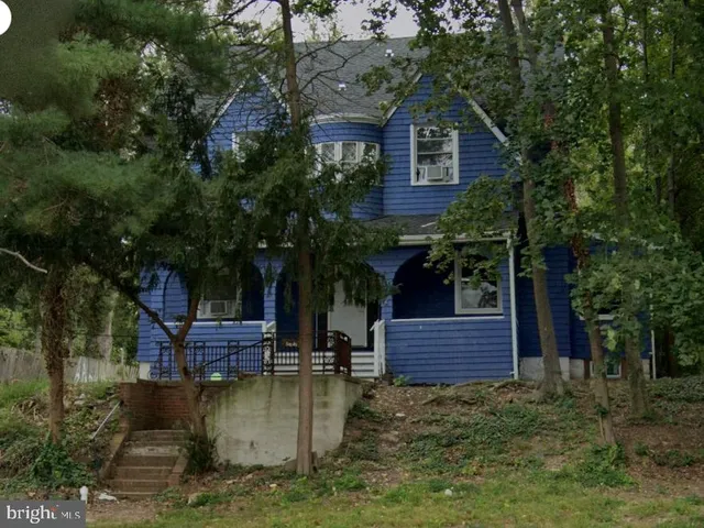 a view of house with trees in the background