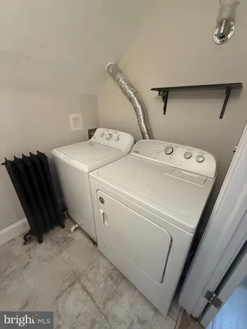 a bathroom with a sink a toilet and bathtub