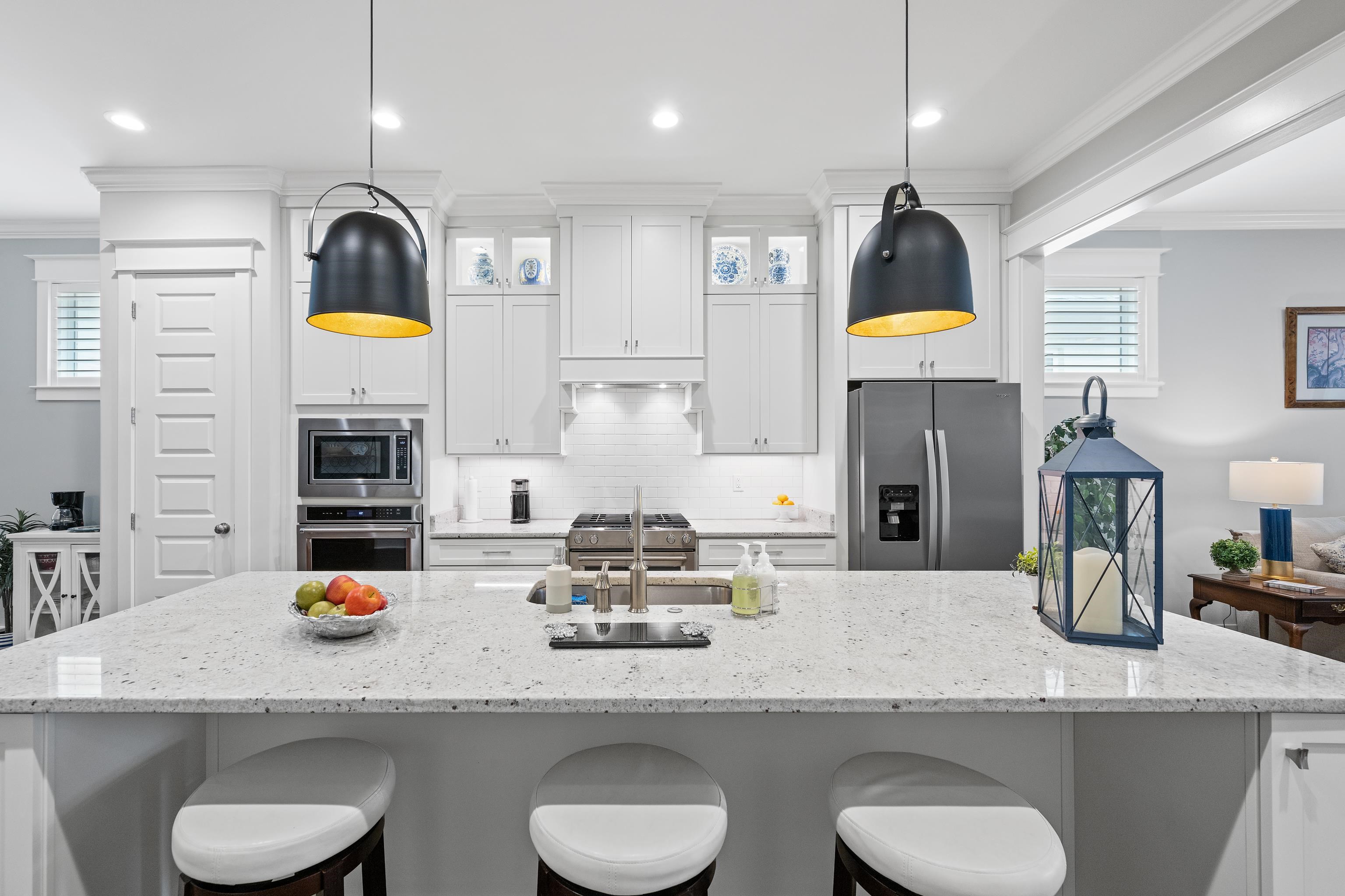 502 South Shea Road Collierville, TN 38017 - Photo 14 of 40 Kitchen featuring decorative backsplash, white cabinets, appliances with stainless steel finishes, and ornamental molding