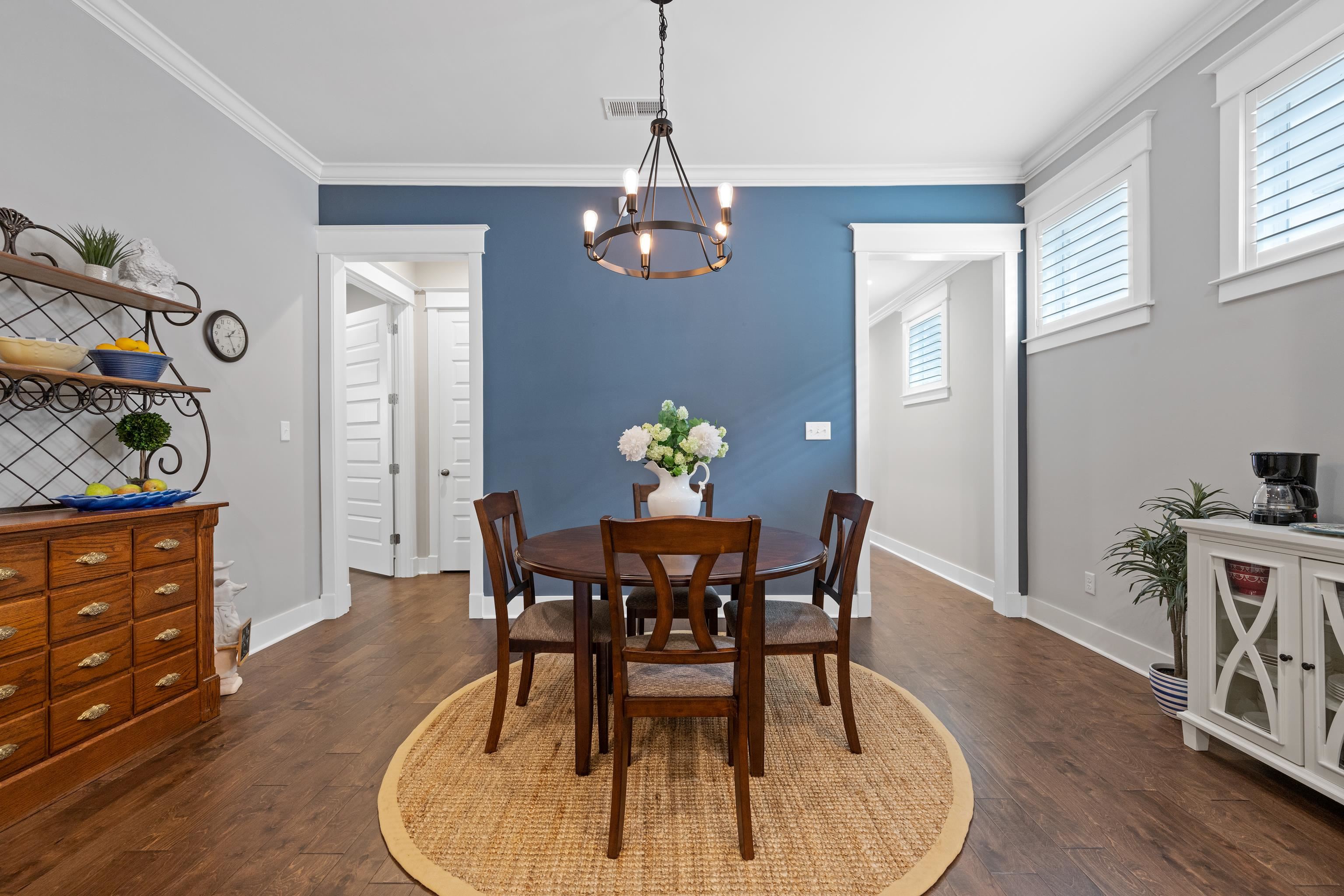502 South Shea Road Collierville, TN 38017 - Photo 19 of 40 Dining area with dark wood-type flooring, a chandelier, and ornamental molding