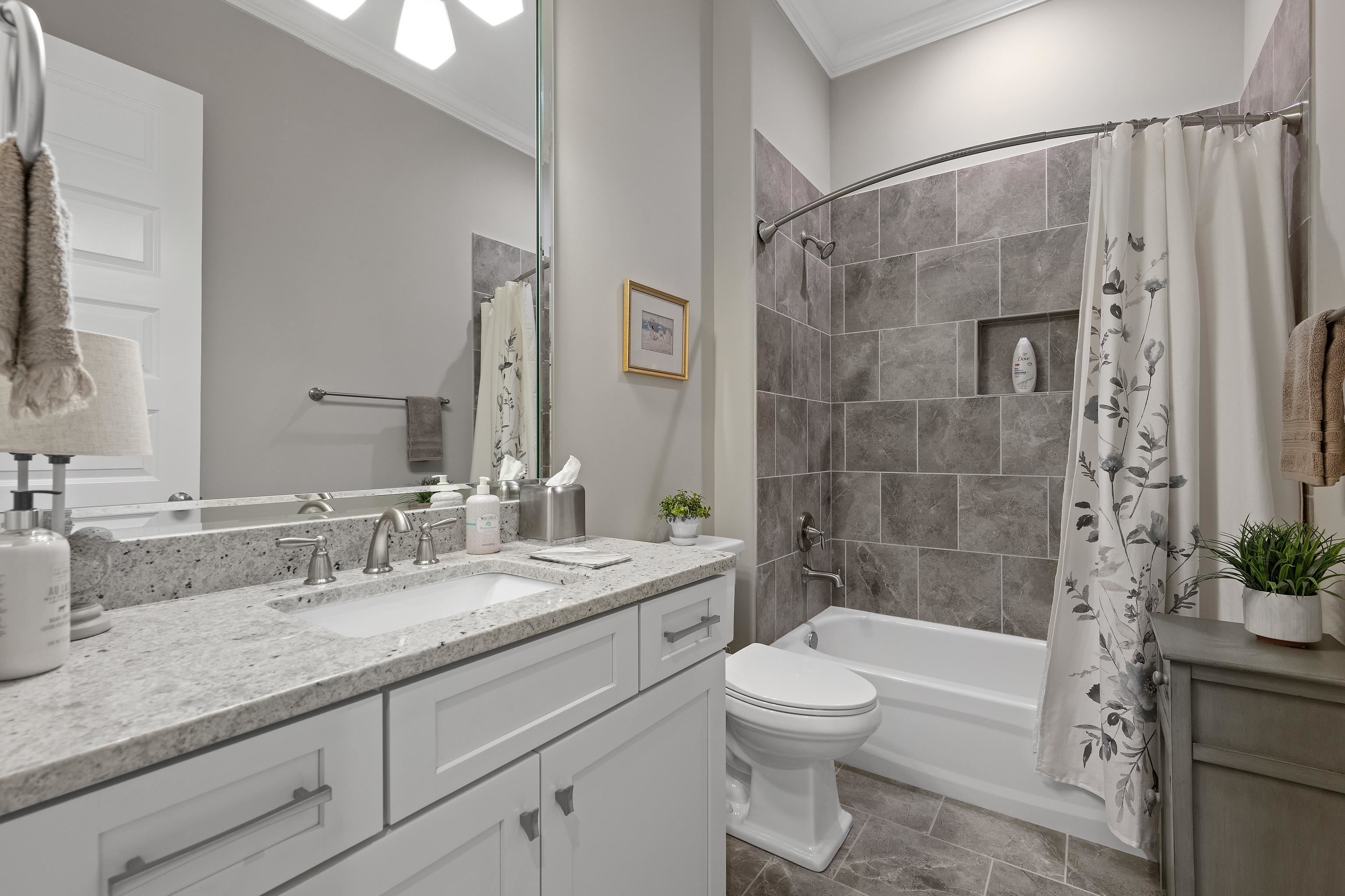 502 South Shea Road Collierville, TN 38017 - Photo 27 of 40 Full bathroom featuring vanity, crown molding, shower / bath combo with shower curtain, toilet, and tile patterned flooring