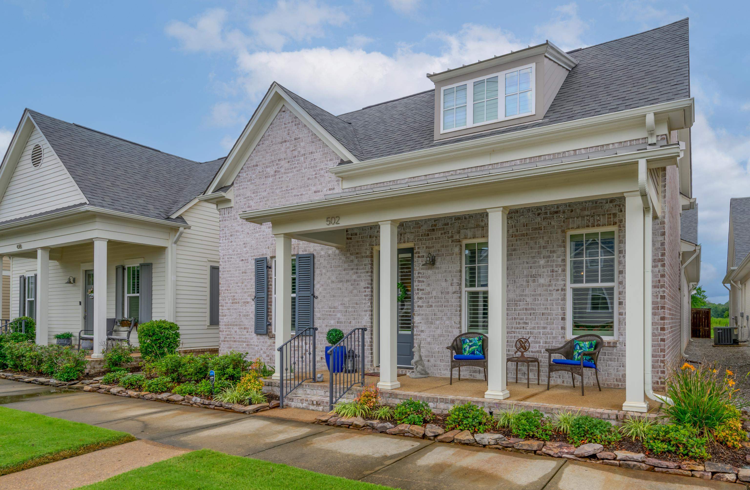 502 South Shea Road Collierville, TN 38017 - Photo 3 of 40 View of front facade with central AC and covered porch